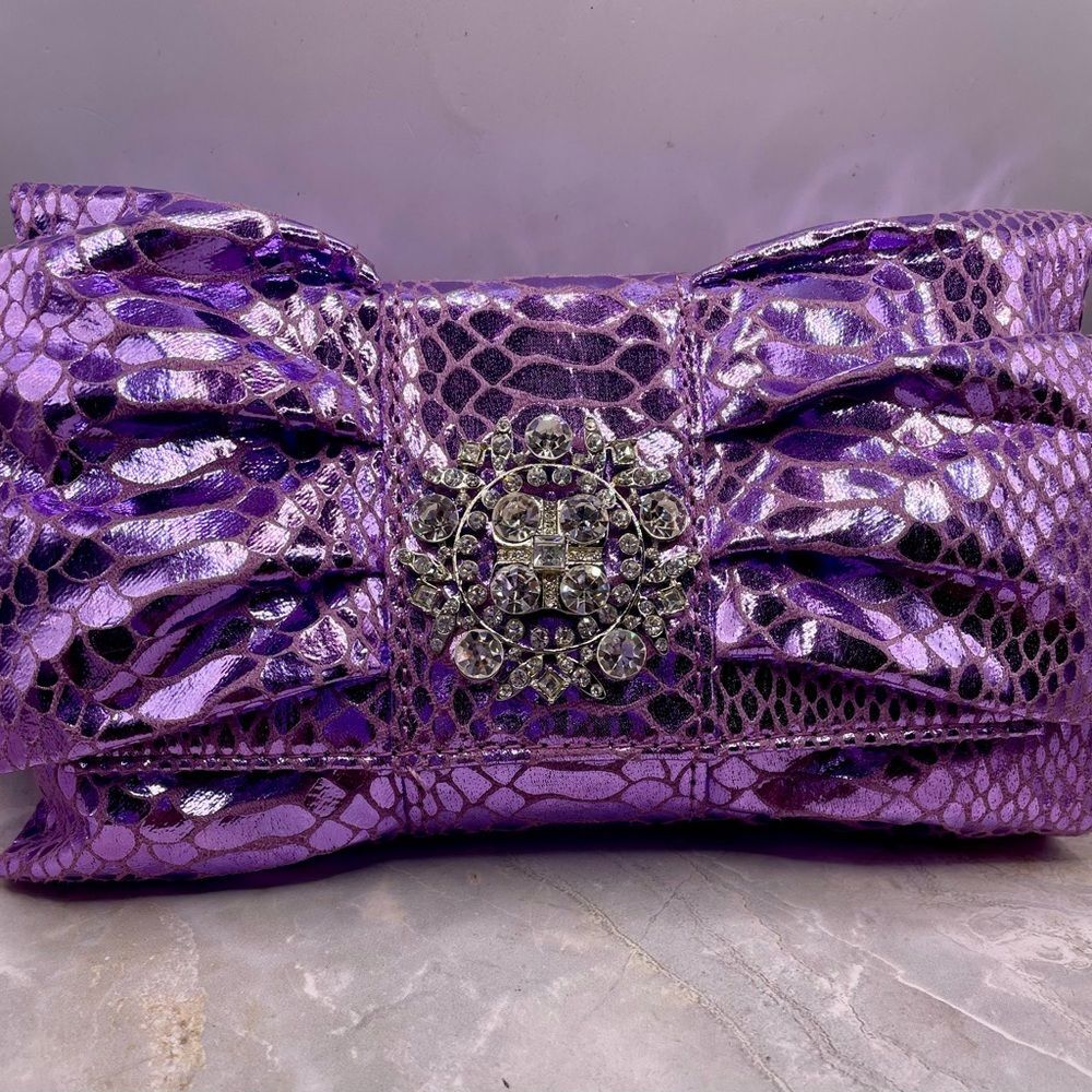 IMAN Purple Faux Snake Skin Bow Clutch with Rhinestone Medallion. 44 inch strap